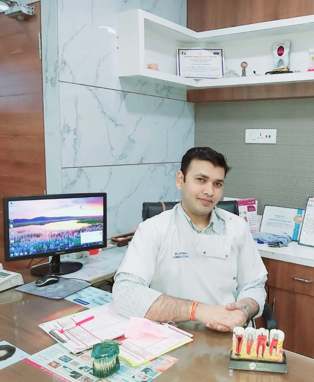 Dr. Abhinav Shrivastava seated in his Jabalpur dental clinic